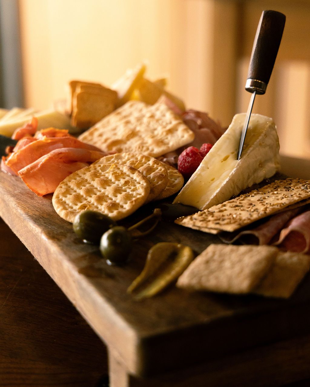 A charcuterie board with cured meats and cheese