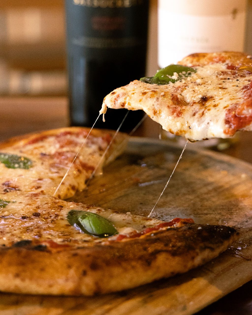 A cheese pull from a fresh slice of pizza