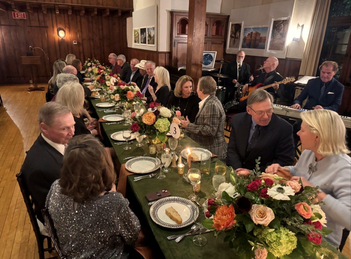 An elegant dinner event with florals and live music